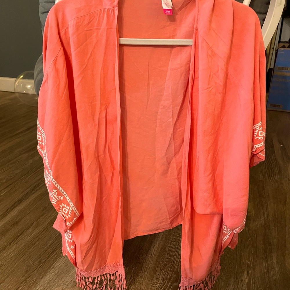 Tribal embroidered over cover.